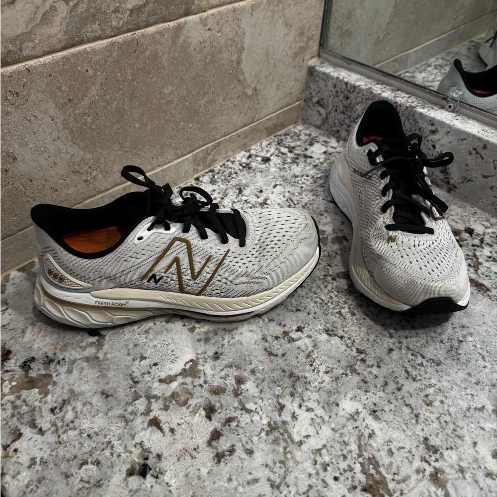 New Balance White and Gold Athletic Shoes